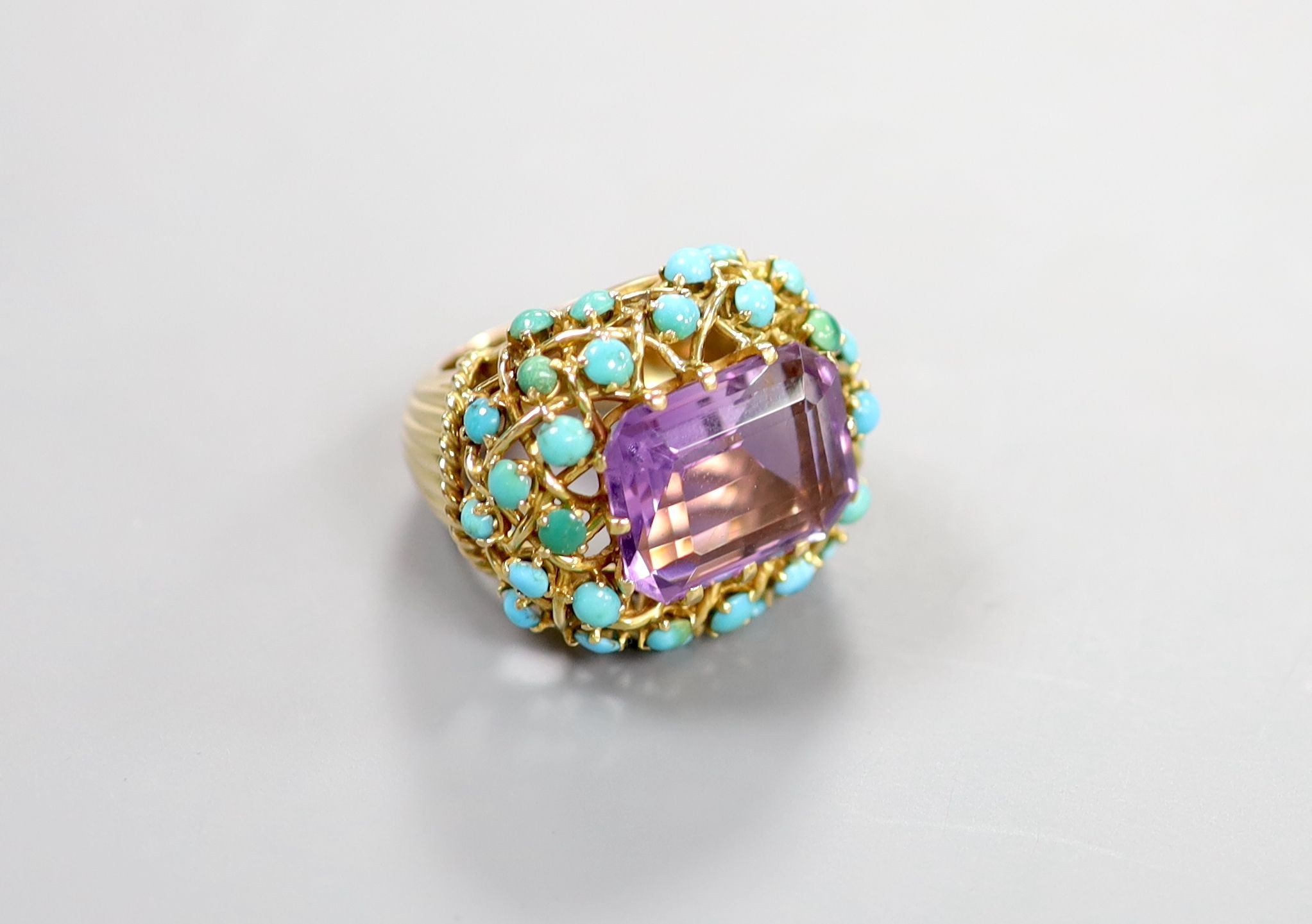 A French yellow metal (18ct poincon mark), amethyst and turquoise set cluster dress ring, with ribbed shank, size J, gross weight 19.2 grams.